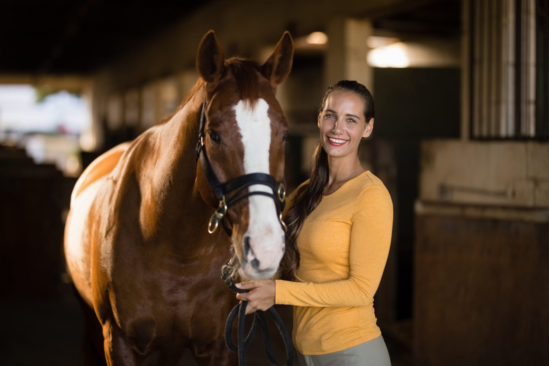 What will I get from the saddle fitter pathway course? Photograph of a lady posing with a horse